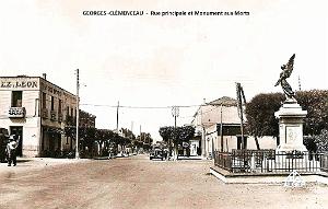 GEORGES-CLEMENCEAU - RUE PRINCIPALE ET MONUMENT AUX MORTS